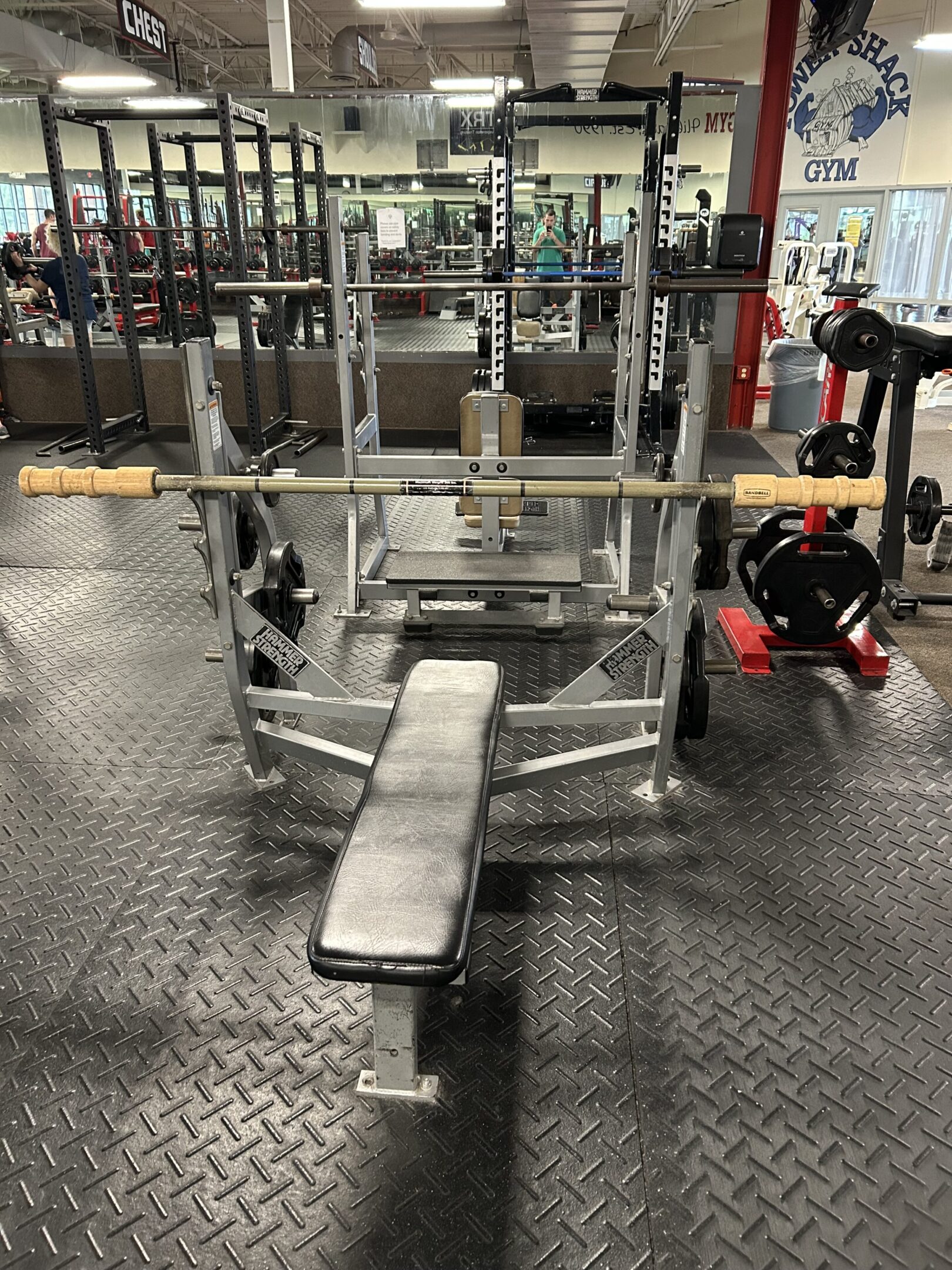 Earthquake Bar Pic A bench with two bars on it in the gym.