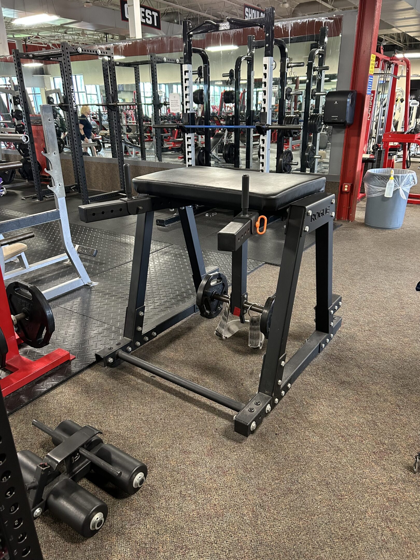Reverse Hyper Pic A gym with many machines and equipment in it