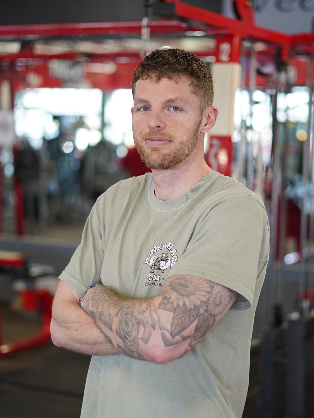 _0000_68027873857c1_Jake Landtiser Pickerington A man with tattoos standing in a gym.
